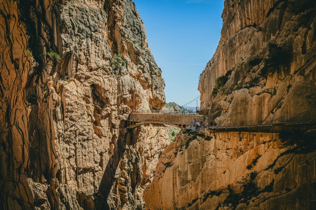 Explore the breathtaking El Caminito del Rey walkway suspended between rocky cliffs in Malaga.
